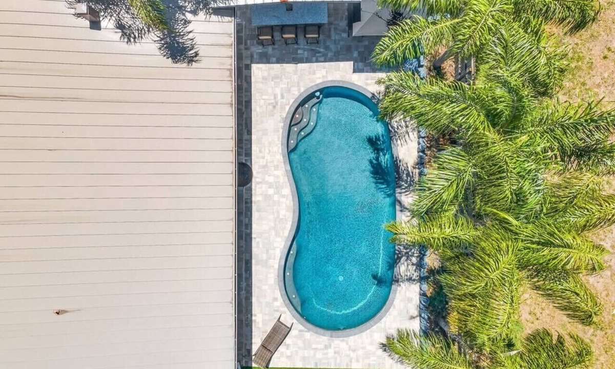 Isle of Palms Villa | 4BR Heated Pool, Putting Green & Outdoor Bar | Near Mayo Clinic Jacksonville | Sleeps 10 SMV