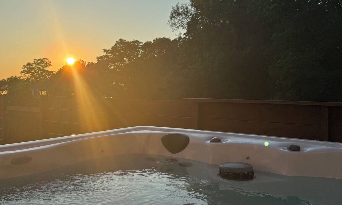 Romulus House | A dreamy Seneca Lake retreat with sweeping views, a relaxing hot tub under the stars, flexible bedroom setups, a fully stocked kitchen, cozy living spaces, and easy access to the lake, wineries, and waterfalls.