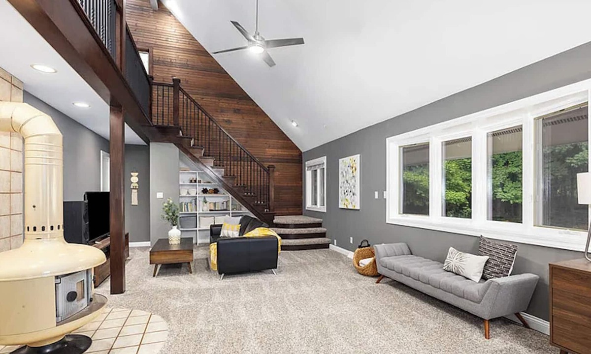 Ada House | Escape to a 4BR/2Bath wooded retreat just minutes from Grand Rapids.