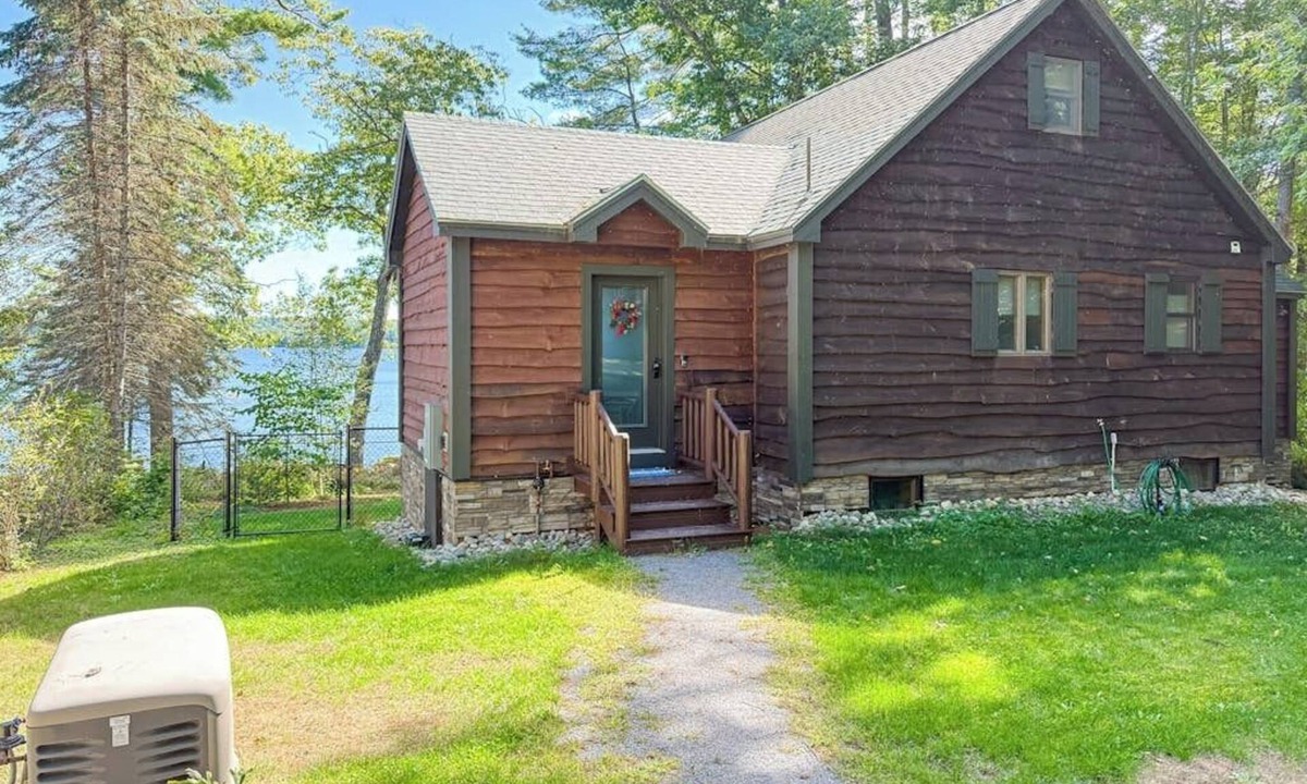 Rome House | Inviting Lakeside Home with direct dock access, patio seating, and gas fireplace
