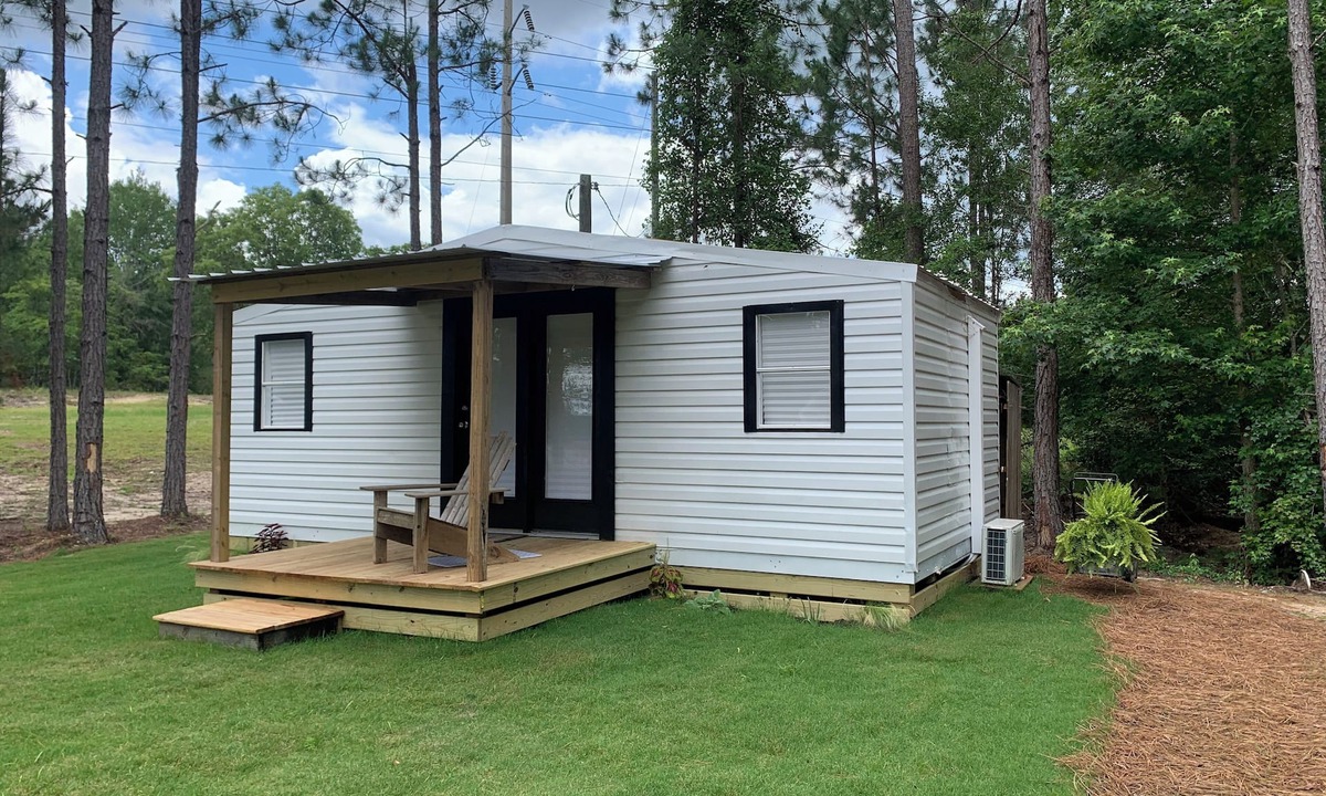 Eastman Cottage | Modern tiny house with large outdoor area and grill.