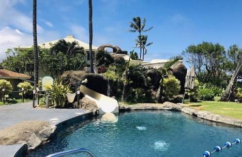 Hanamaulu Condo | Oceanfront Kauai Beach Resort 75 foot waterslide, 4 pools, Jacuzzis, restaurants