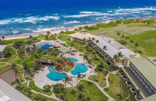 Hanamaulu Condo | Oceanfront Kauai Beach Resort 75 foot waterslide, 4 pools, Jacuzzis, restaurants