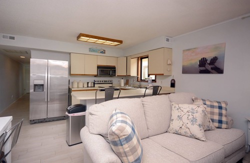 Caine Woods Condo | 2-bedroom condo with an outdoor pool located uptown on the bayside in a peaceful, family-friendly neighborhood!