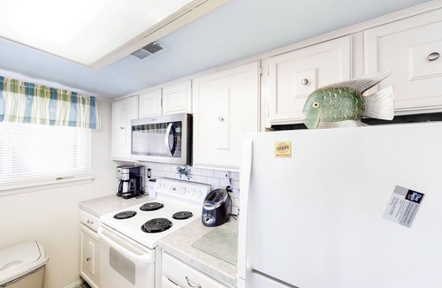 North Ocean City Condo | Canal-Front Retreat w/Pool - Walk to Beach & Restaurants