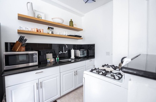 East Village Apartment | Chic Condo w Parking, AC and steps to Beach and Convention Center