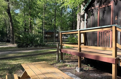 Folkston Cabin | Deluxe Cabin - The River Otter Lodge - Our Deluxe Cabins offer comfort with a true Okefenokee feel. Climate controlled, private, and set in a quiet part of the campground.
