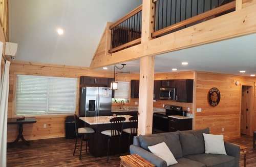 Smithfield Cabin | Enjoy amazing sunsets while steps from North Pond in this cozy 3-bedroom camp.
