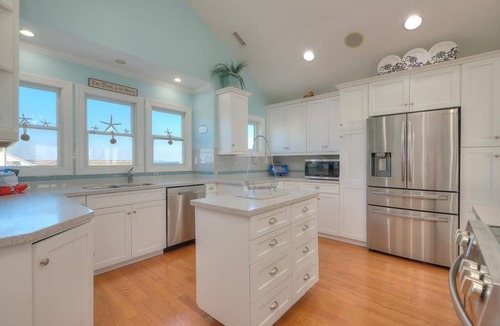 Caswell Beach House | Experience oceanfront luxury at Sea for Miles in Oak Island, NC, with 5 bedrooms!