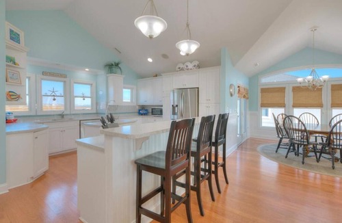 Caswell Beach House | Experience oceanfront luxury at Sea for Miles in Oak Island, NC, with 5 bedrooms!
