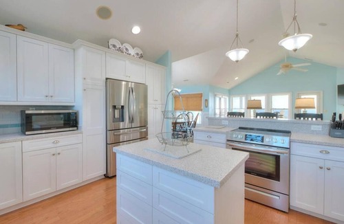 Caswell Beach House | Experience oceanfront luxury at Sea for Miles in Oak Island, NC, with 5 bedrooms!