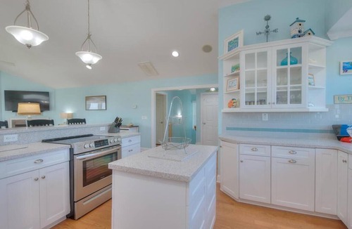 Caswell Beach House | Experience oceanfront luxury at Sea for Miles in Oak Island, NC, with 5 bedrooms!