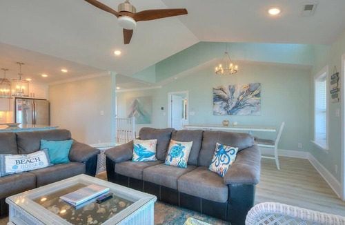 Long Beach House | Experience oceanfront bliss at Blue Yonder, a spacious 4-bedroom retreat in Oak Island.