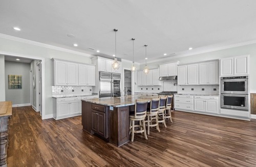 North Topsail Beach House | Experience oceanfront luxury at Topsail Manor, a spacious 8-bedroom paradise in North Topsail Beach.