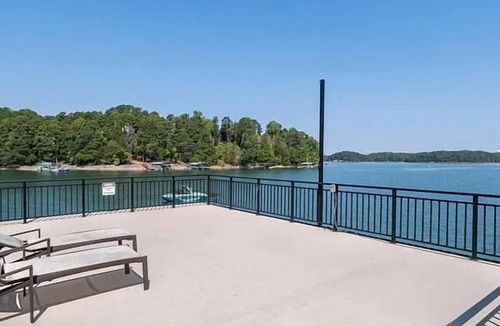 Buford House | Lake Lanier Luxury Water Front Retreat with Large Dock, Boat Rental & Lake Views