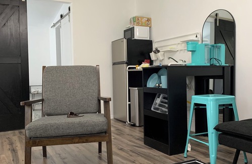 Eastman Cottage | Modern tiny house with large outdoor area and grill.