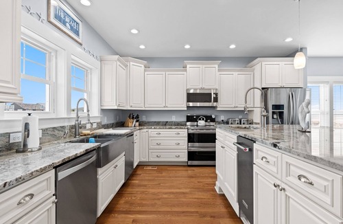 Yaupon Beach House | Orange Sunset: Spacious 7-bedroom oceanfront gem in Oak Island, perfect for large groups.