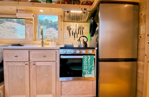 Arroyo Hondo Cabin | Rainbow Tiny Home with View & Hot Tub near Hot Springs, El Prado, NM