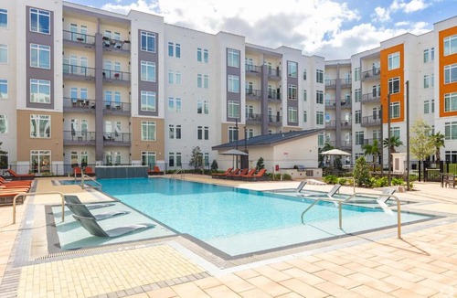 Florida Center Apartment | Riviere 2BR Apartment Pet Friendly Oasis Sleeps 6 Close to Epic Universe Pool & Gym