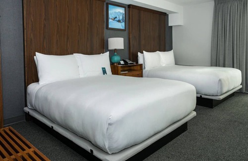 North Park City Hotel | Room with Enchanting Mountain Feel & Relaxation Amenities | 4 Family Ready Stay