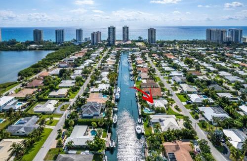 Singer Island Villa | Seven Palms Waterfront- Private Dock, Heated Pool & Lanai -Walk to beach! by Maven Vacation Rentals