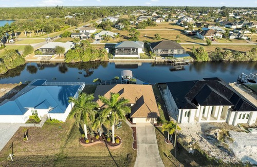 Burnt Store House | Spacious 4-bedroom house in charming Cape Coral Heated Pool & Fishing Dock kayak
