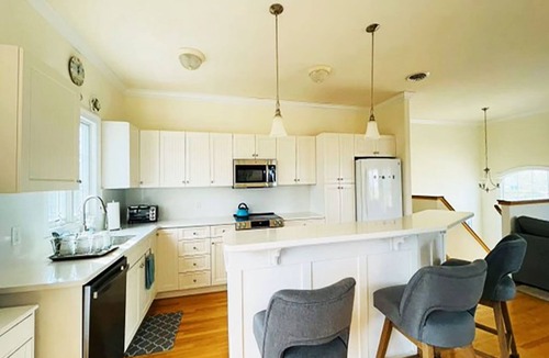 Town Bank House | Spacious Bayside Retreat: Sleeps 18, 1/2 Block from Bay Beach, Game Room