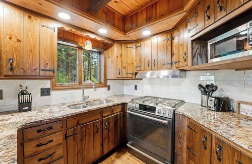 Bigfork House | Swan Mountain cabin with amazing views, hot tub, large deck, & game room