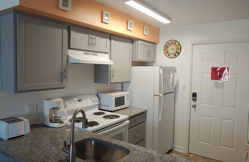 North Ocean City Condo | Two-level condo with balcony, AC, pool & dock - blocks to beach/Northside Park