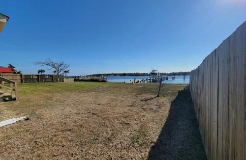 Cedar Point House | Waterfront home with Private Dock Hot tub and swimming as well as a large fenced backyard