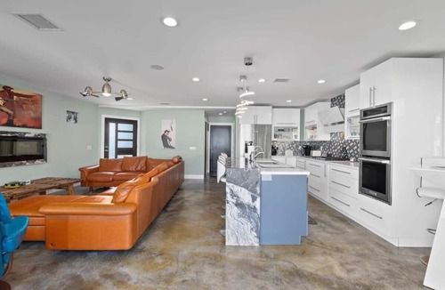 Sunset Beach House | Waterfront Luxury w/Hot Tub & Free Duffy Boat