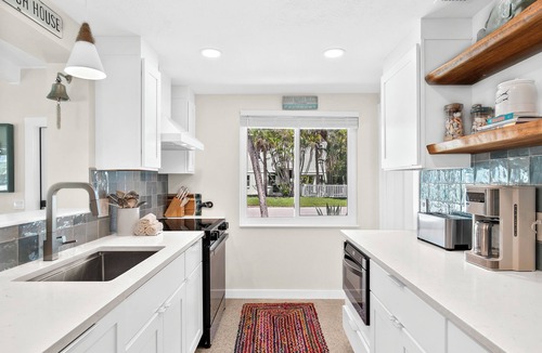 Holmes Beach House | While Away A · EV Charger · Fenced Pool · Renovated 2025