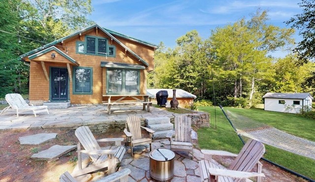 Belgrade Lakes getaway with private swim dock, outdoor living, & canoe/kayaks