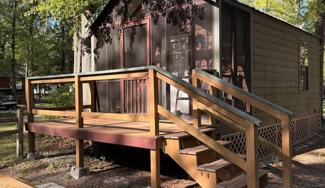 Deluxe Cabin - The Gator Hole - Our Deluxe Cabins offer comfort with a true Okefenokee feel. Climate controlled, private, and set in a quiet part of the campground.