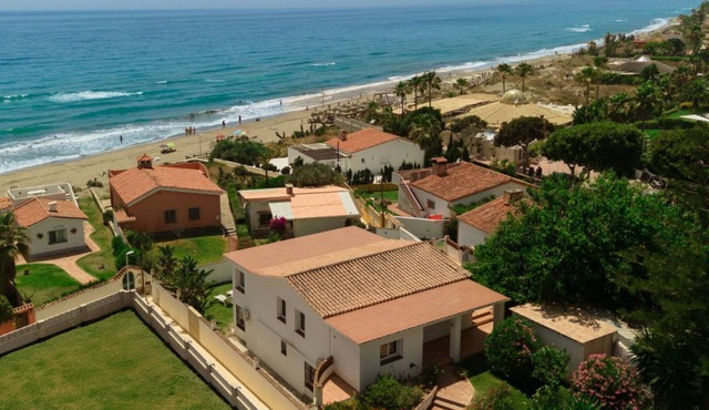In the second line, modern beachfront holiday home in Costabella, Marbella