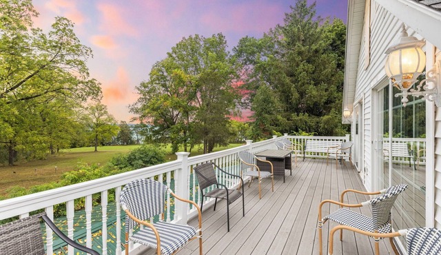 Lakefront at its finest—two homes, a private beach, and spectacular Cayuga Lake views.
