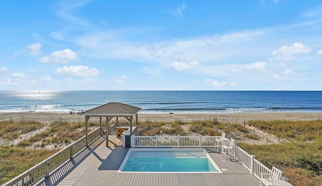 Oceanfront Serenity Sands in Oak Island, NC, boasts 8 bedrooms for 20 guests.