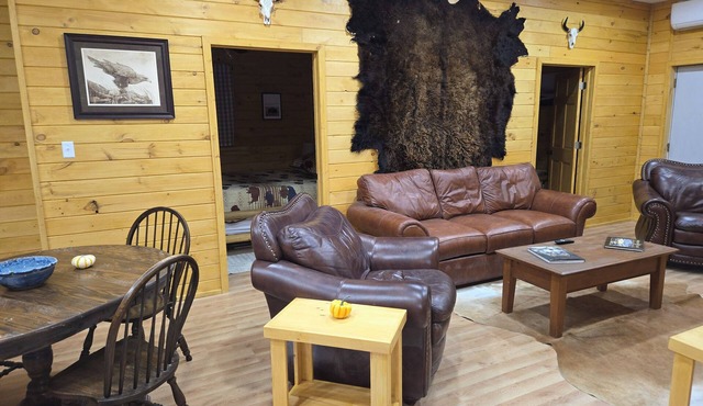 Peaceful 2-bedroom cabin with AC in charming Irons, hot tub, sauna, covered deck