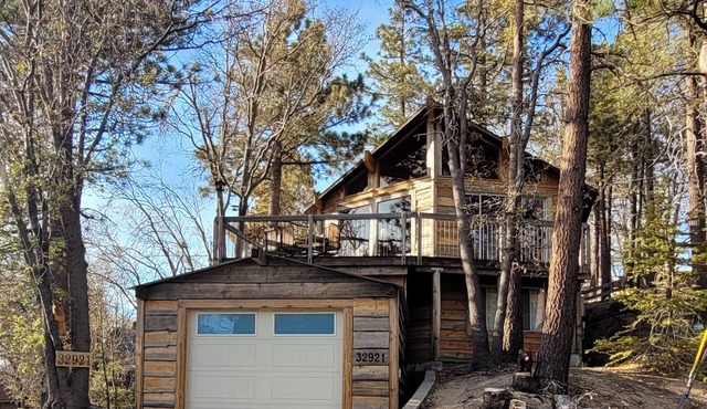 Spacious 2-bedroom 2 bath cabin with one car attached garage and sunset views.