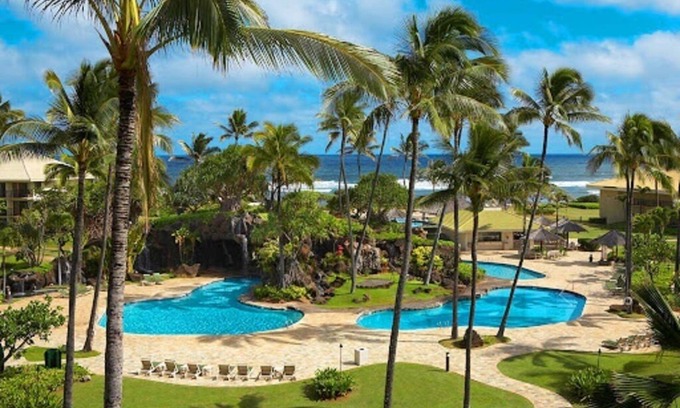 Hanamaulu Condo | Oceanfront Kauai Beach Resort 75 foot waterslide, 4 pools, Jacuzzis, restaurants