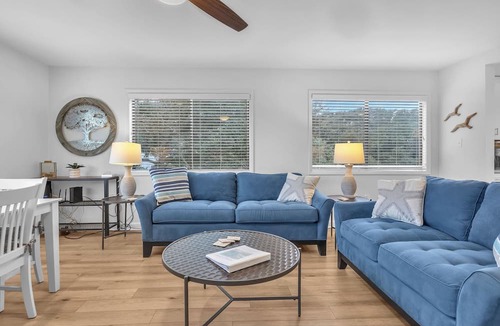 Caswell Beach Condo | Beach Getaway Among the Oaks: Community Pools, Short Walk to Beach Access
